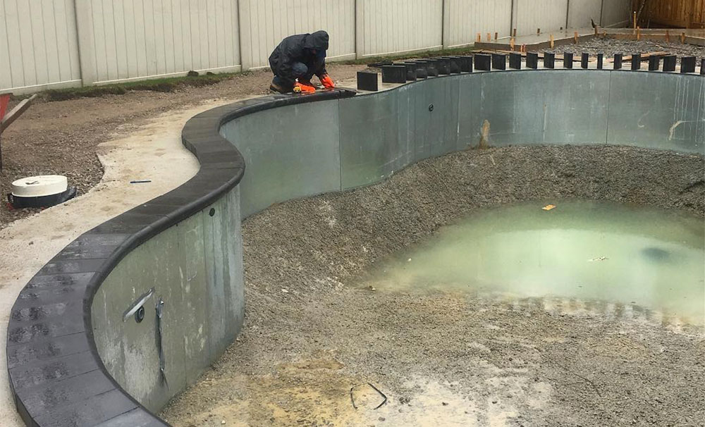 Pool Coping being installed around an in-ground pool